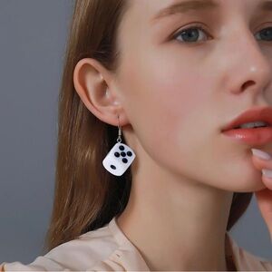 Chunky black and white dice earrings.